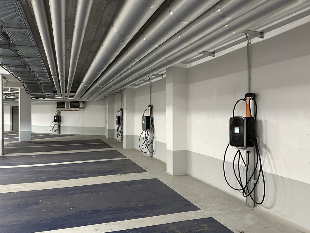 Charging station for electric cars in public parking garage